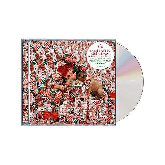 CD album cover for Sia’s ’Everyday Is Christmas’ featuring a festive, colorful design with a person and dog amid Christmas-themed patterns.