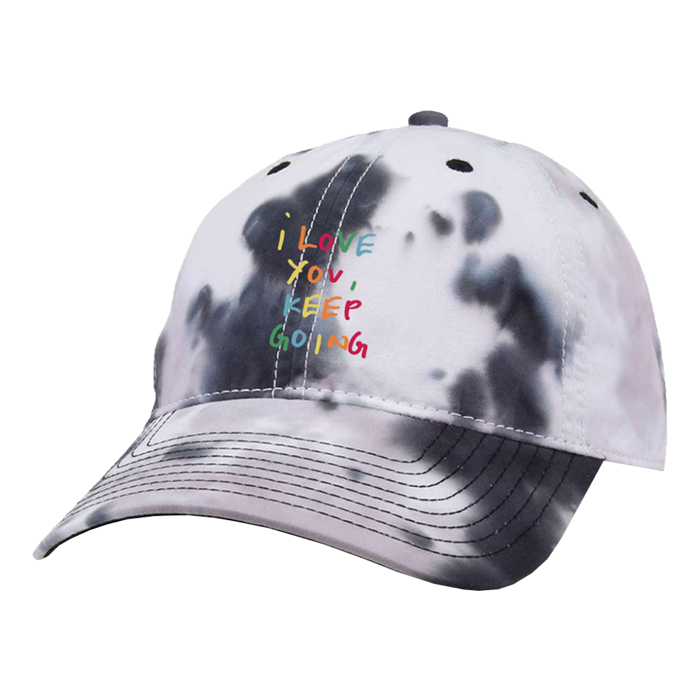 Tie-dye baseball cap with colorful embroidered text ’i love you keep going’.